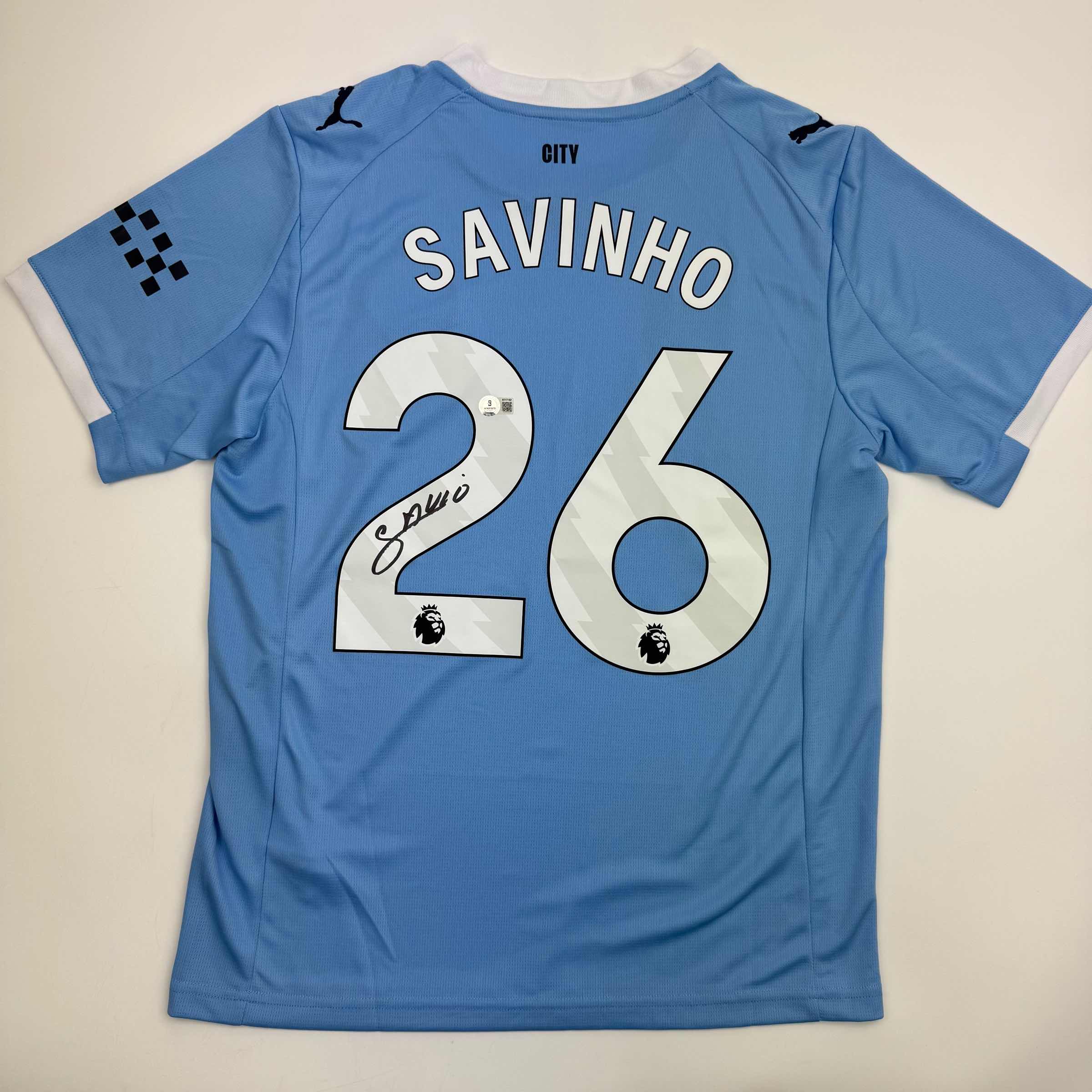Autographed/Signed Savinho Manchester City Blue Soccer Futbol Jersey Beckett BAS COA