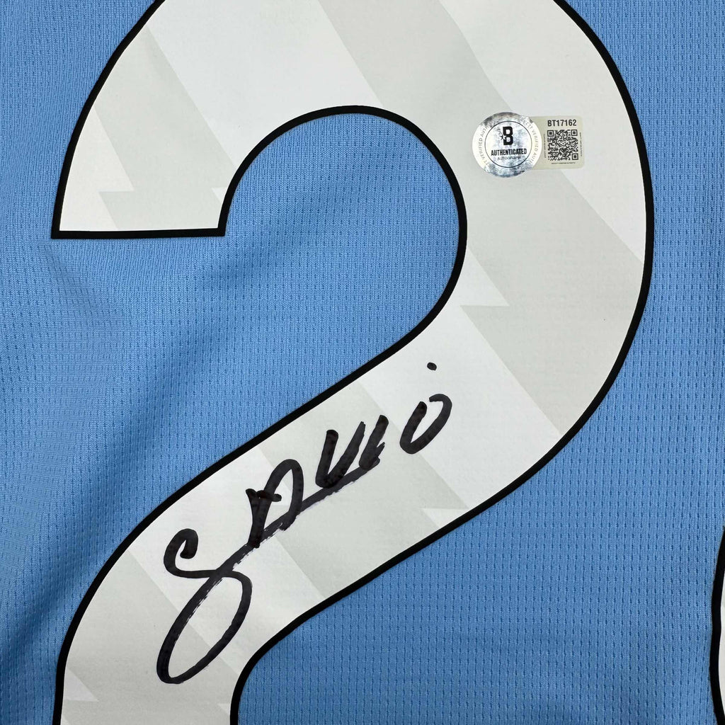 Autographed/Signed Savinho Manchester City Blue Soccer Futbol Jersey Beckett BAS COA